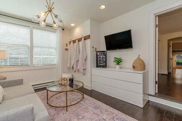 233 Preston Rd, Columbus, OH 43209 - living room featuring a baseboard heating unit, dark wood-style floors, recessed lighting, and arched walkways