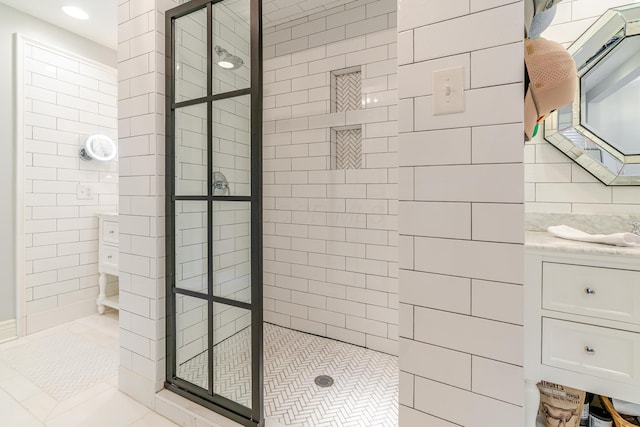 233 Preston Rd, Columbus, OH 43209 - full bathroom with a tile shower, tile walls, vanity, and tile patterned flooring