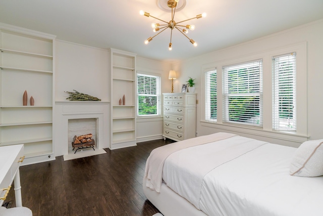 233 Preston Rd, Columbus, OH 43209 - bedroom with a chandelier, multiple windows, dark wood finished floors, and a fireplace