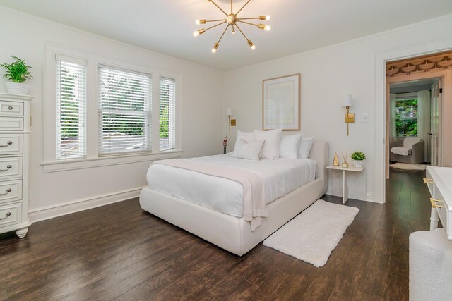 233 Preston Rd, Columbus, OH 43209 - bedroom with dark wood finished floors, multiple windows, a chandelier, and ornamental molding