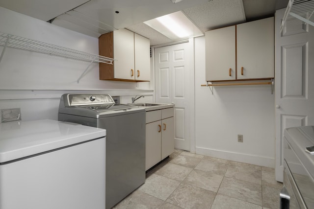 233 Preston Rd, Columbus, OH 43209 - washroom featuring cabinet space and separate washer and dryer