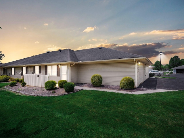 4401 Hammerton Dr Unit 13A, Columbus, OH 43228 - view of side of home featuring a yard and a garage