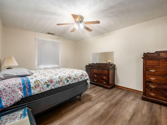 4401 Hammerton Dr Unit 13A, Columbus, OH 43228 - bedroom featuring wood finished floors and ceiling fan