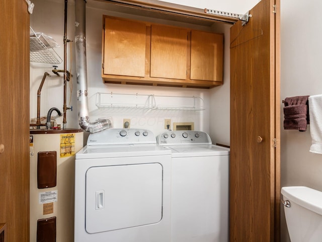 4401 Hammerton Dr Unit 13A, Columbus, OH 43228 - laundry area with water heater, cabinet space, and separate washer and dryer