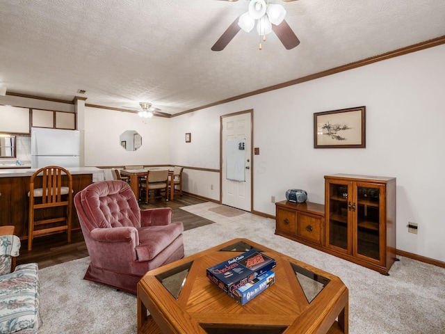 4401 Hammerton Dr Unit 13A, Columbus, OH 43228 - living area with ceiling fan, crown molding, a textured ceiling, and light colored carpet