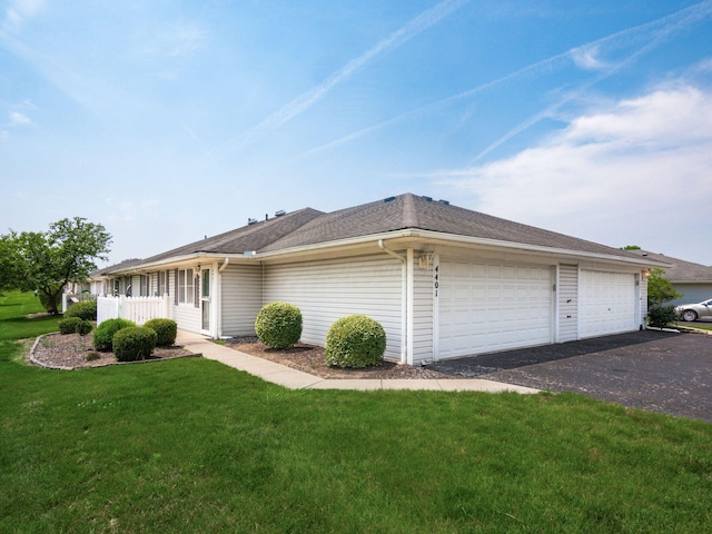 4401 Hammerton Dr Unit 13A, Columbus, OH 43228 - view of side of home with a lawn, a garage, and driveway