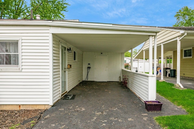 4388 Allen Dr, Columbus, OH 43213 - view of parking with an attached carport and driveway
