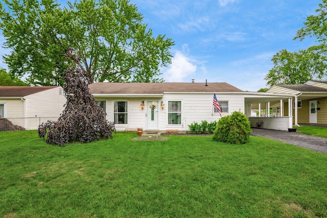 4388 Allen Dr, Columbus, OH 43213 - single story home featuring asphalt driveway, an attached carport, and a front yard