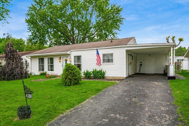 4388 Allen Dr, Columbus, OH 43213 - view of front of property featuring asphalt driveway, a front yard, and an attached carport
