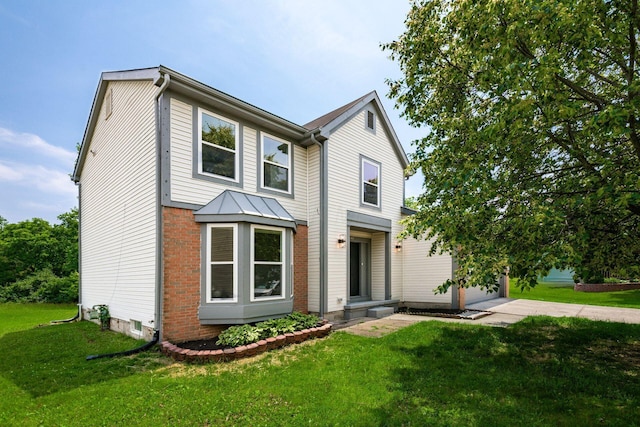 2840 Harnet Ct, Columbus, OH 43231 - traditional-style home featuring a front yard, concrete driveway, brick siding, and an attached garage
