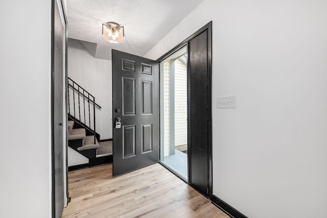 2840 Harnet Ct, Columbus, OH 43231 - entrance foyer with light wood-style floors and stairs