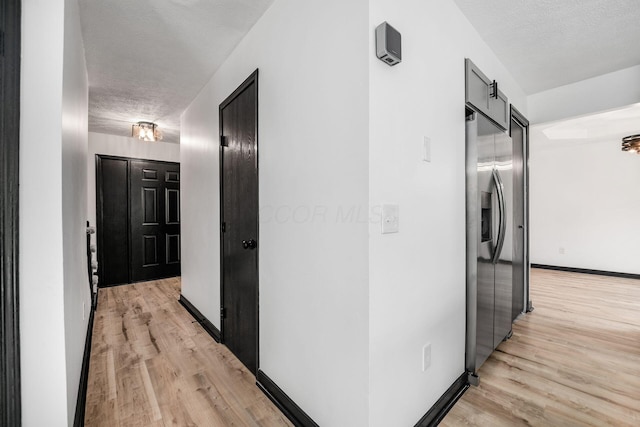 2840 Harnet Ct, Columbus, OH 43231 - hall featuring a textured ceiling and light wood-type flooring