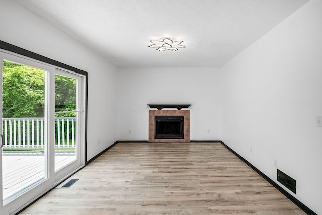 2840 Harnet Ct, Columbus, OH 43231 - unfurnished living room with a fireplace and light wood-style floors