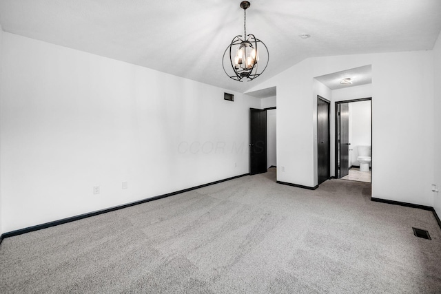 2840 Harnet Ct, Columbus, OH 43231 - spare room with carpet floors, a chandelier, and vaulted ceiling