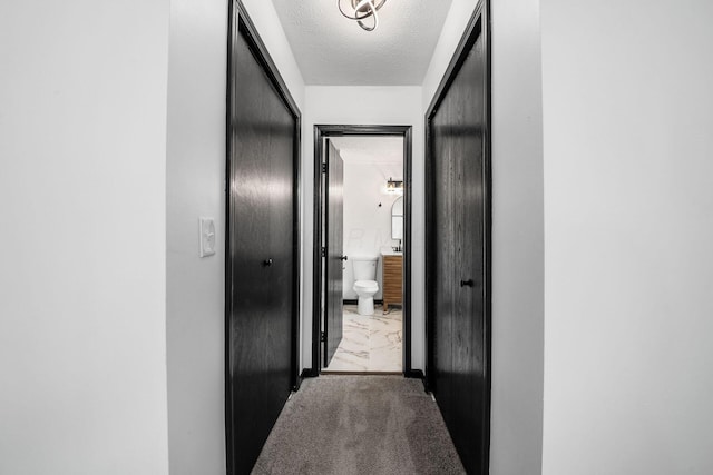 2840 Harnet Ct, Columbus, OH 43231 - hall featuring marble finish flooring and a textured ceiling