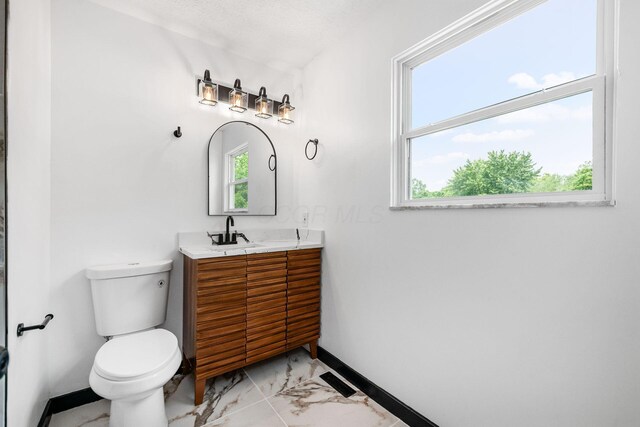 2840 Harnet Ct, Columbus, OH 43231 - bathroom featuring marble finish flooring and vanity