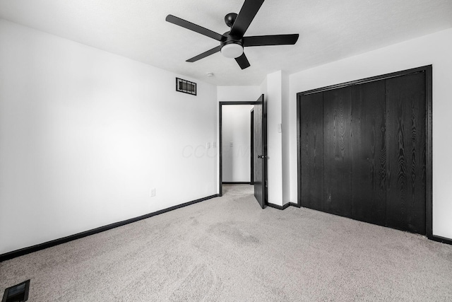 2840 Harnet Ct, Columbus, OH 43231 - unfurnished bedroom featuring carpet, ceiling fan, and a closet