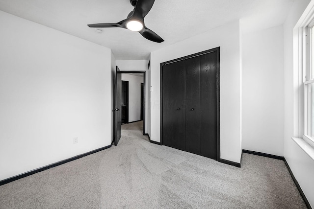 2840 Harnet Ct, Columbus, OH 43231 - unfurnished bedroom featuring carpet floors, multiple windows, a closet, and ceiling fan