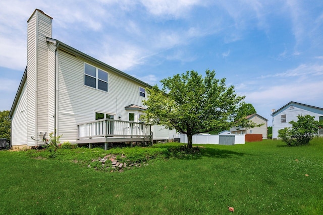 2840 Harnet Ct, Columbus, OH 43231 - back of house with a chimney and a wooden deck