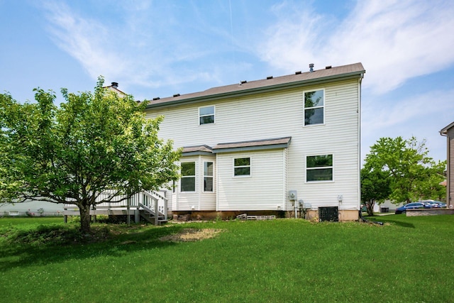 2840 Harnet Ct, Columbus, OH 43231 - rear view of house with a lawn and a chimney