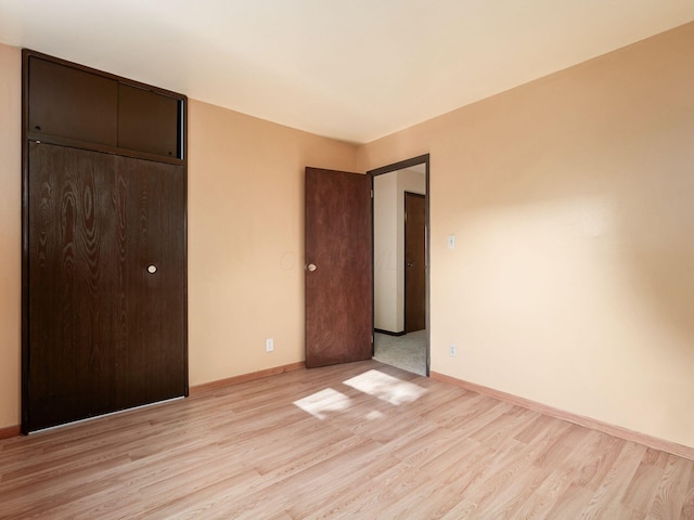 668 Kenilworth Ct, Columbus, OH 43230 - unfurnished bedroom with light wood-style flooring and a closet