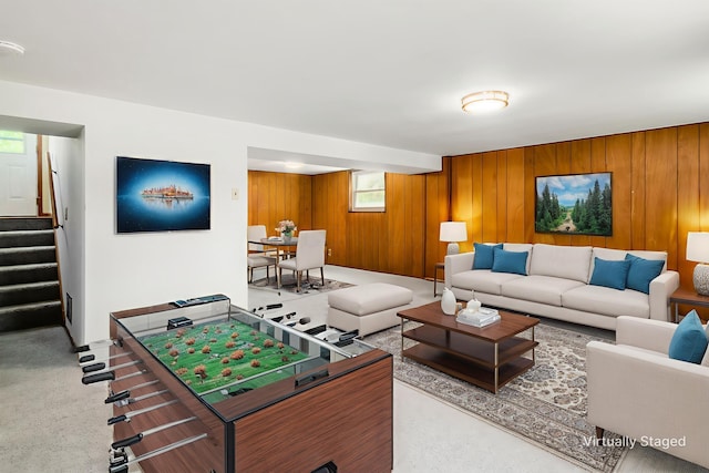 668 Kenilworth Ct, Columbus, OH 43230 - carpeted living area featuring stairs and wooden walls