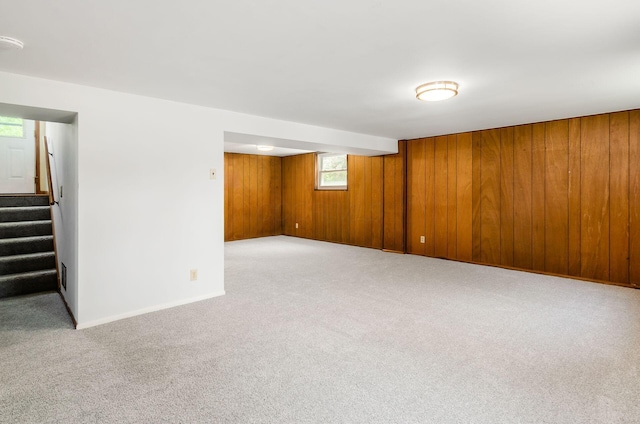 668 Kenilworth Ct, Columbus, OH 43230 - basement featuring wood walls, stairway, and carpet flooring