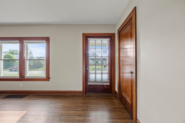 685 S Hague Ave, Columbus, OH 43204 - doorway to outside with dark wood finished floors and baseboards