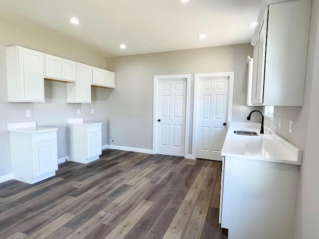 32352 Lilac Ln, Logan, OH 43138 - kitchen with dark wood-type flooring, white cabinets, recessed lighting, and light countertops