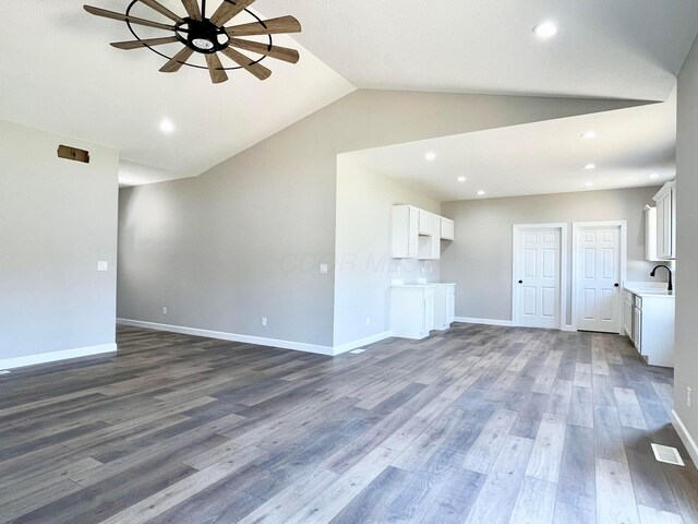 32352 Lilac Ln, Logan, OH 43138 - unfurnished living room featuring ceiling fan, dark wood finished floors, vaulted ceiling, and recessed lighting
