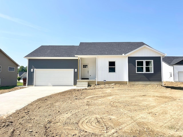 32352 Lilac Ln, Logan, OH 43138 - view of front of property with driveway, an attached garage, and a shingled roof