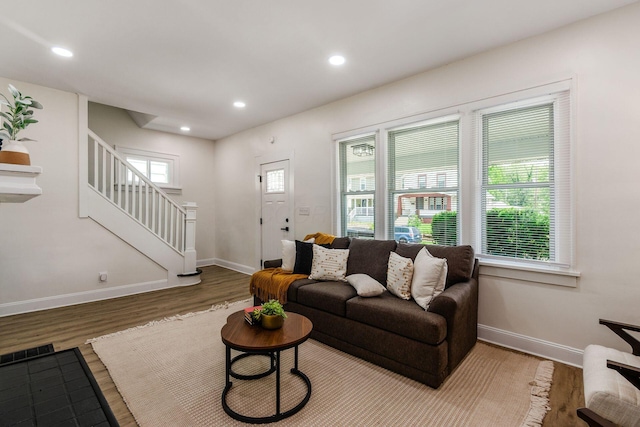 1233 Oakwood Ave, Columbus, OH 43206 - living room with wood finished floors, stairway, and recessed lighting