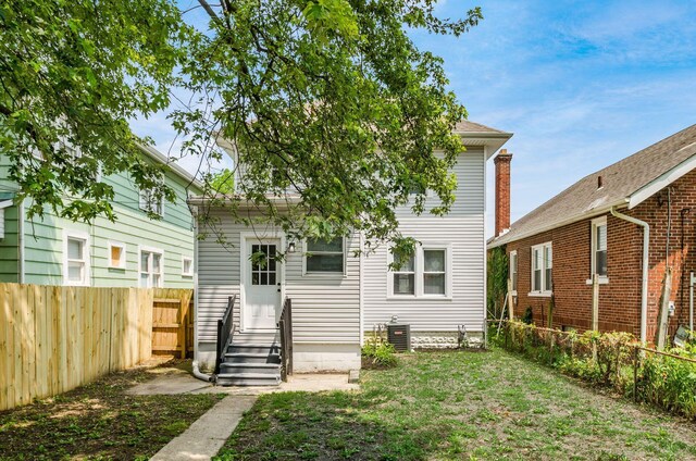 1233 Oakwood Ave, Columbus, OH 43206 - rear view of house with entry steps and a fenced backyard
