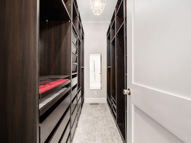 248 E Whittier St, Columbus, OH 43206 - walk in closet with light carpet and a chandelier