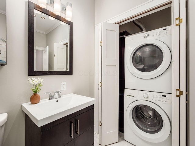 248 E Whittier St, Columbus, OH 43206 - washroom with stacked washing machine and dryer and crown molding