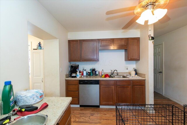 1935 Sedan Ave, Obetz, OH 43207 - kitchen with dishwasher, light countertops, light wood-style floors, a ceiling fan, and brown cabinets