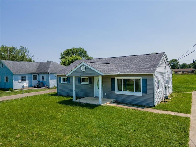 1935 Sedan Ave, Obetz, OH 43207 - view of front of home featuring a front yard, roof with shingles, and covered porch