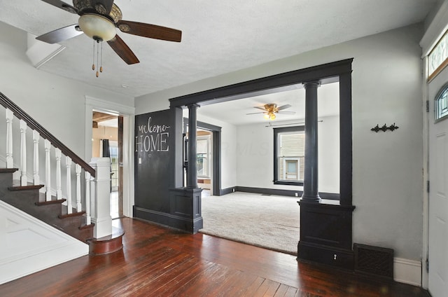 835 Rogers St, Bucyrus, OH 44820 - entrance foyer with a ceiling fan, decorative columns, hardwood / wood-style flooring, and stairway