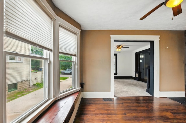 835 Rogers St, Bucyrus, OH 44820 - empty room featuring a ceiling fan and wood finished floors