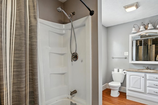 835 Rogers St, Bucyrus, OH 44820 - full bath with wood finished floors, vanity, and shower / bath combination with curtain