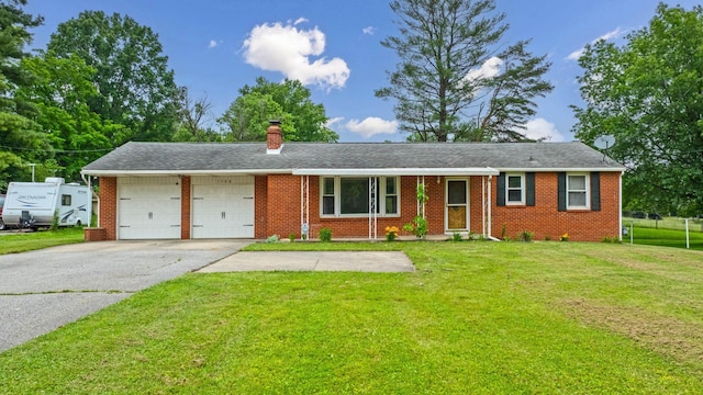 1508 W Hanley Rd, Mansfield, OH 44904 - single story home with a garage, brick siding, a front lawn, driveway, and a chimney