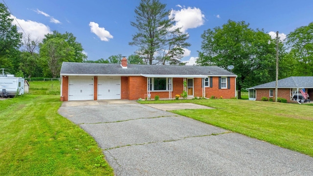 1508 W Hanley Rd, Mansfield, OH 44904 - ranch-style house with a garage, driveway, brick siding, a front yard, and a chimney