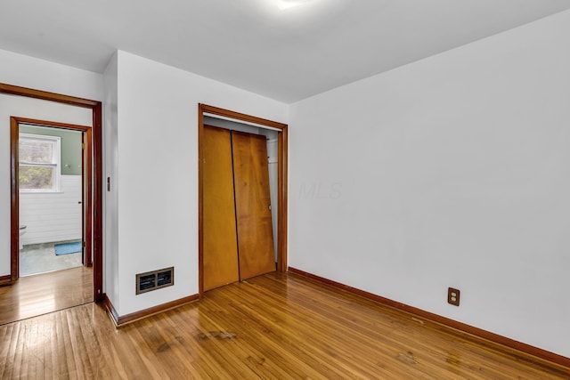 1508 W Hanley Rd, Mansfield, OH 44904 - unfurnished bedroom with light wood-style floors and a closet