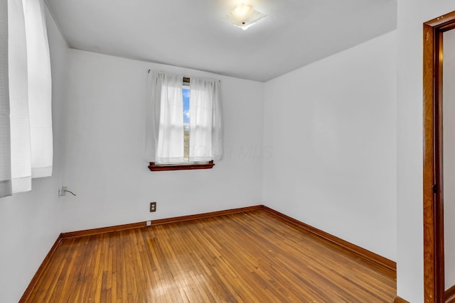 1508 W Hanley Rd, Mansfield, OH 44904 - empty room with baseboards and hardwood / wood-style floors