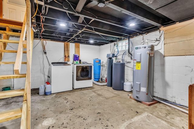 1508 W Hanley Rd, Mansfield, OH 44904 - unfinished basement featuring water heater, washing machine and clothes dryer, a water softener system, a water pressure tank, and concrete block wall