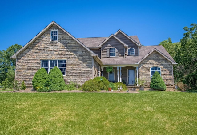 3180 Palmer Dr, Chandlersville, OH 43727 - view of front facade featuring stone siding and a front lawn