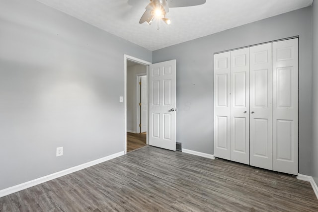 65 Jeffery Ln SE, Heath, OH 43056 - unfurnished bedroom with wood finished floors, a closet, and a ceiling fan
