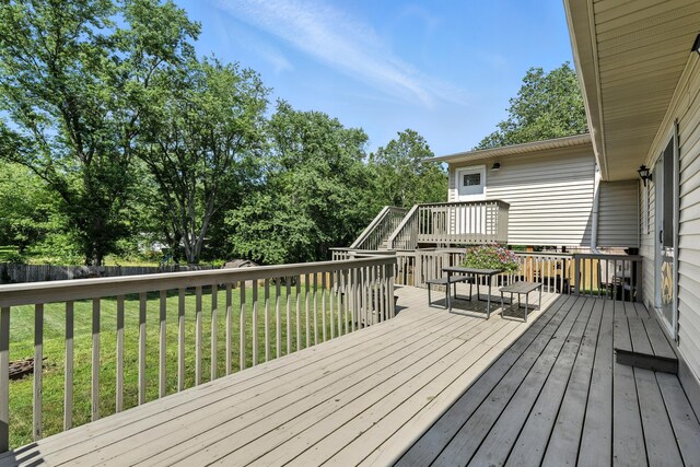 65 Jeffery Ln SE, Heath, OH 43056 - wooden deck with a fenced backyard