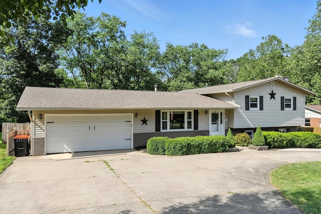 65 Jeffery Ln SE, Heath, OH 43056 - split level home with driveway, brick siding, and a garage