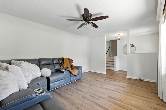 65 Jeffery Ln SE, Heath, OH 43056 - living area with light wood finished floors, stairs, and a ceiling fan